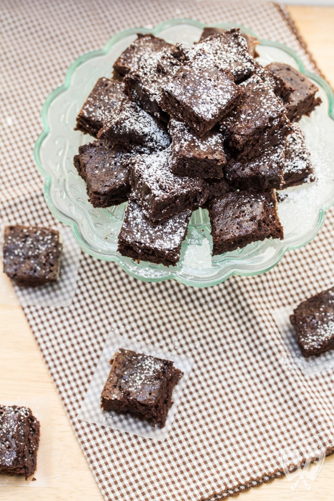 Mini chocolate brownies dusted with powdered sugar